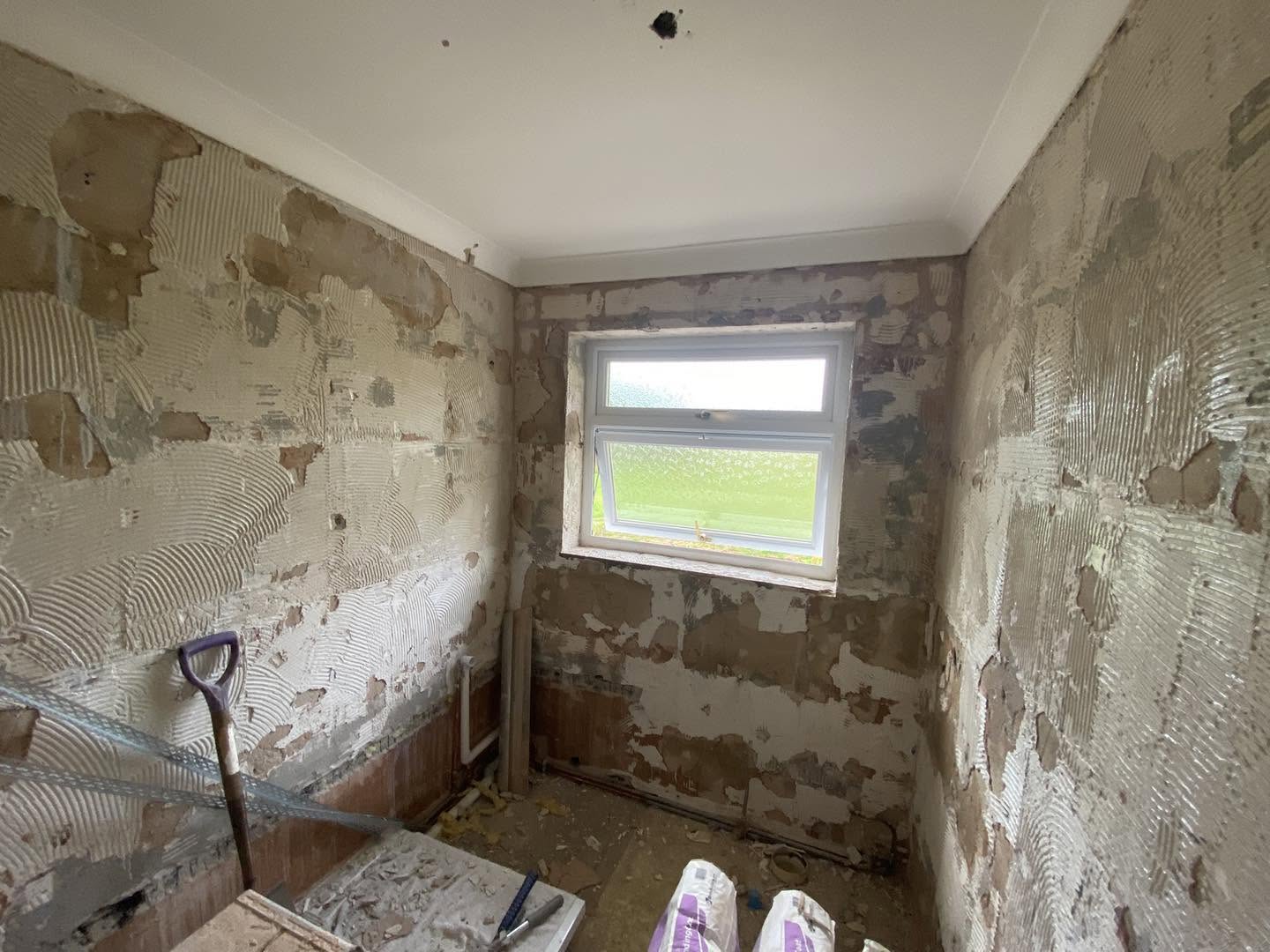 The window wall of the same room, stripped back