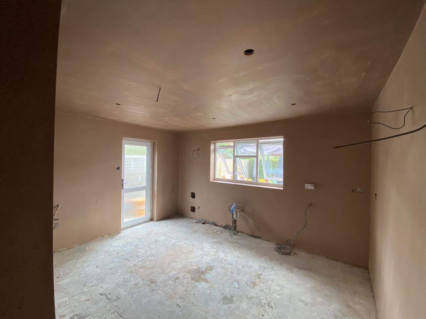 The room from another angle, freshly skimmed, with its windows