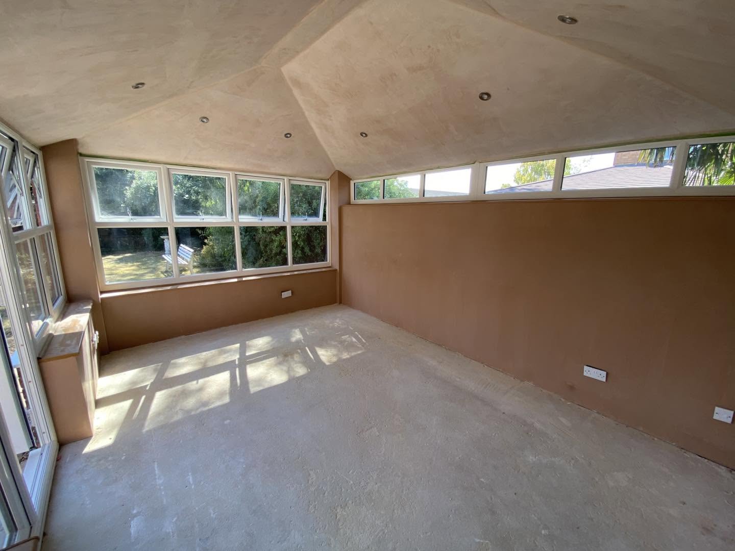 High windows under the finished vaulted ceiling