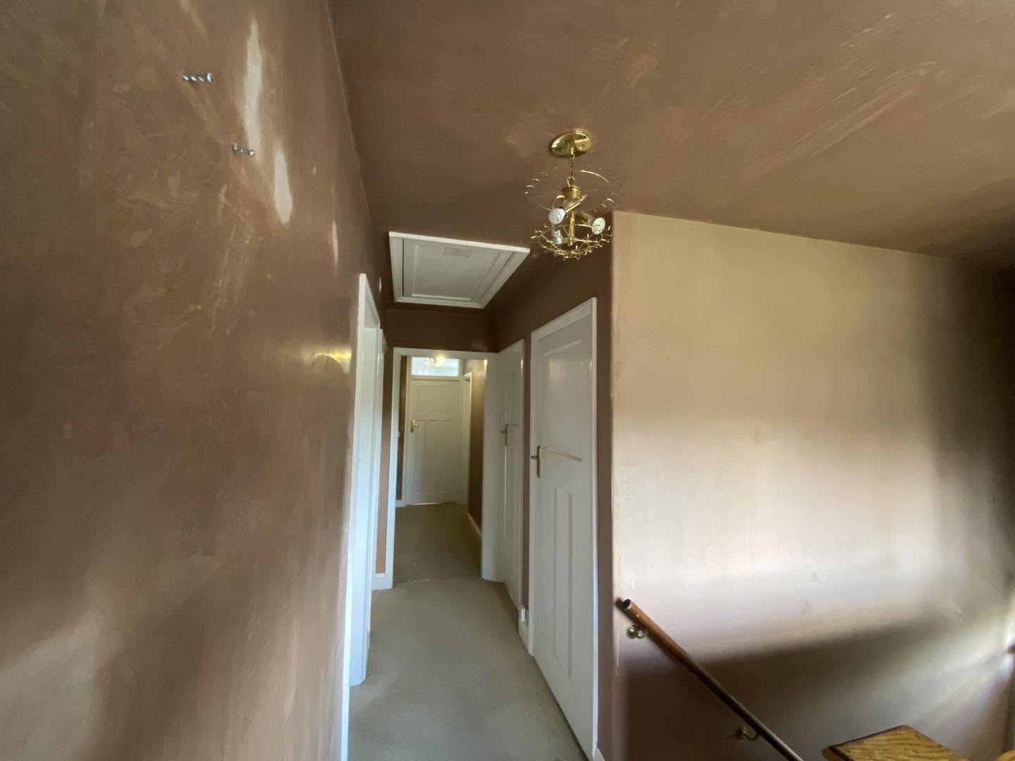 The landing and hallway freshly plastered, loft hatch and chandelier
