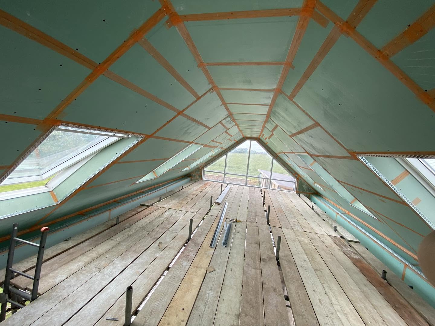 The loft boarded and taped around the roof windows