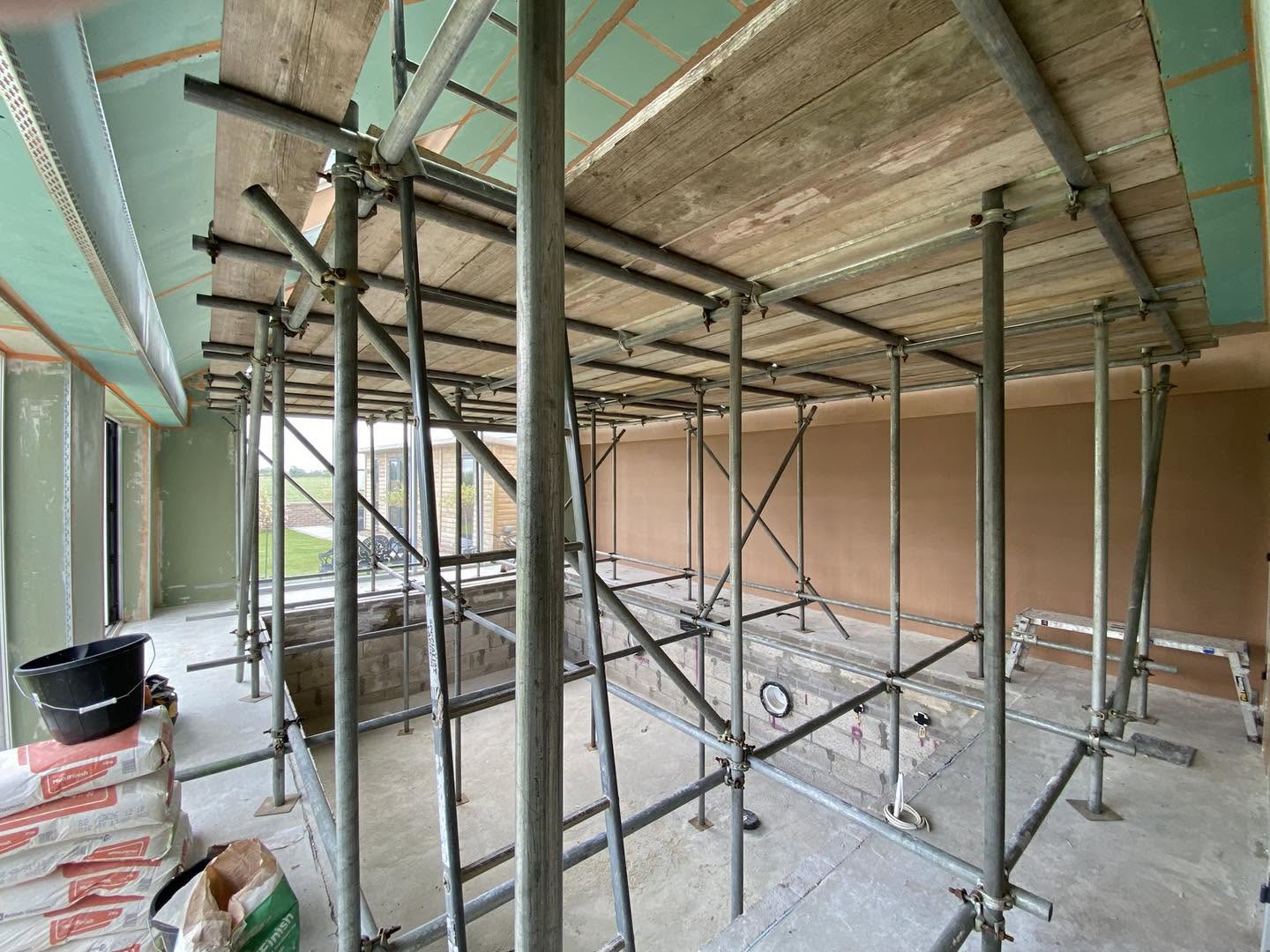 A scaffold tower inside the loft to reach the high ceiling