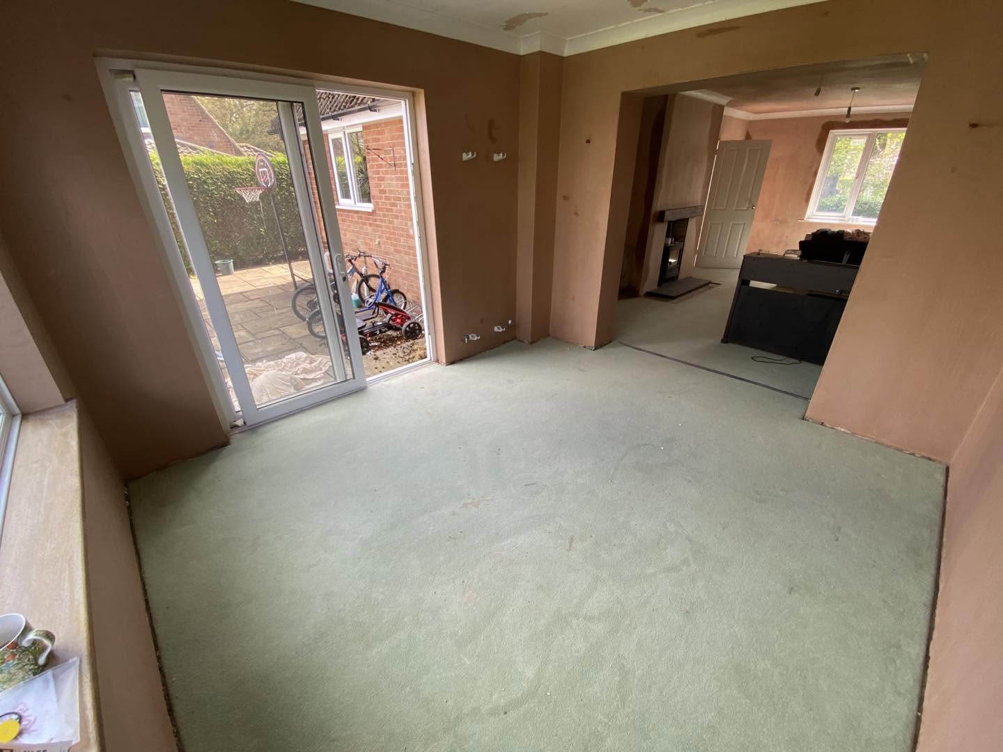 The finished room with its sliding patio doors