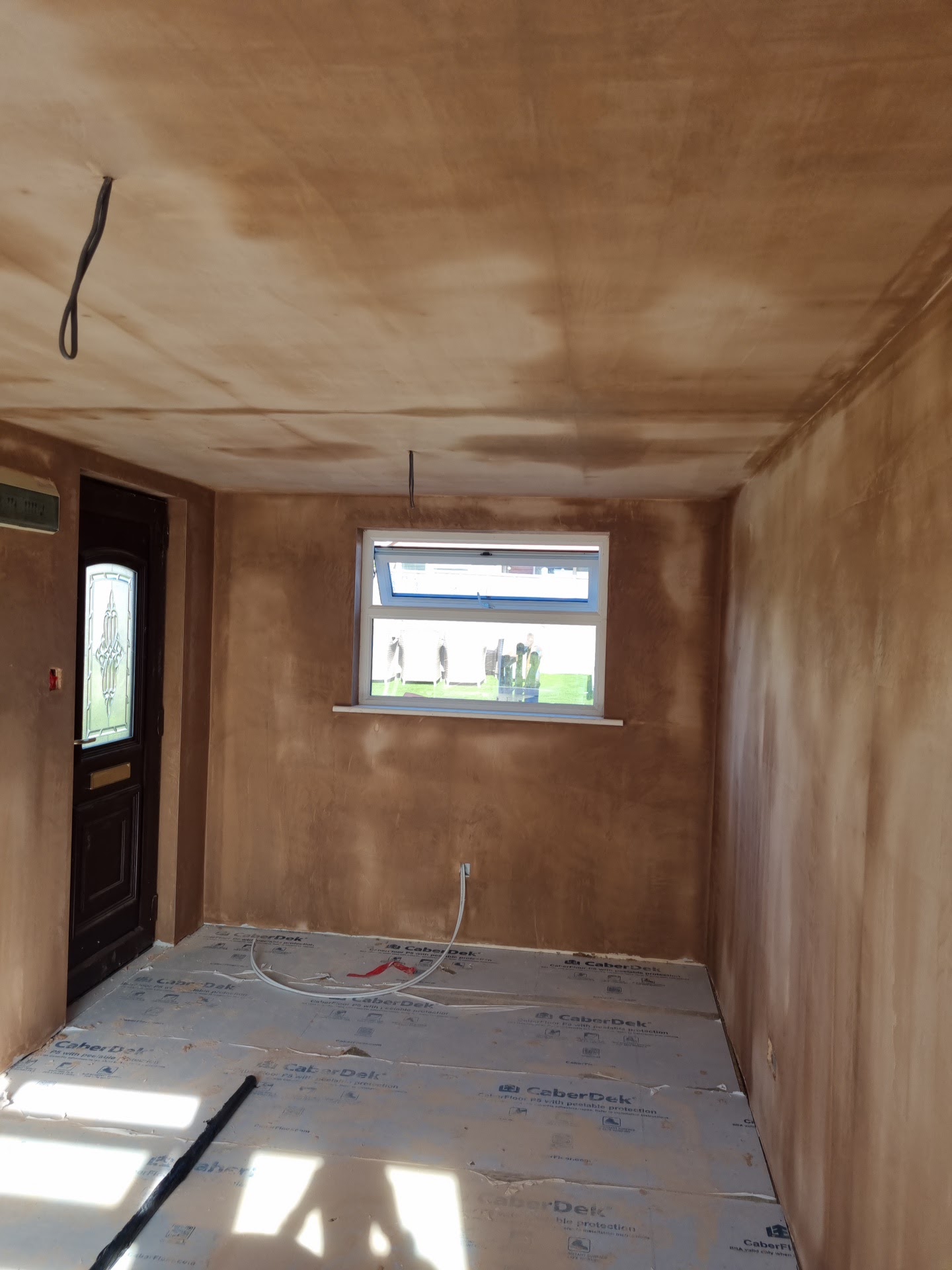 The garage conversion with its walls and ceiling skimmed
