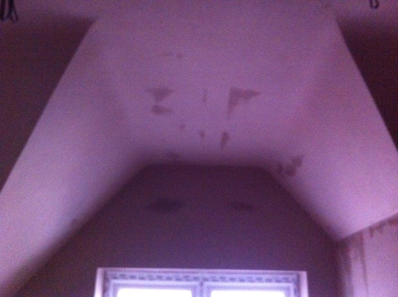 An attic room with its sloped ceilings skimmed
