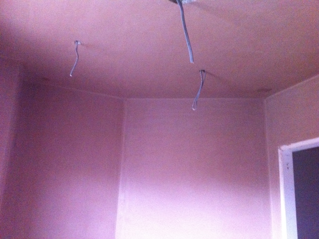 A room skimmed, pendant wires hanging