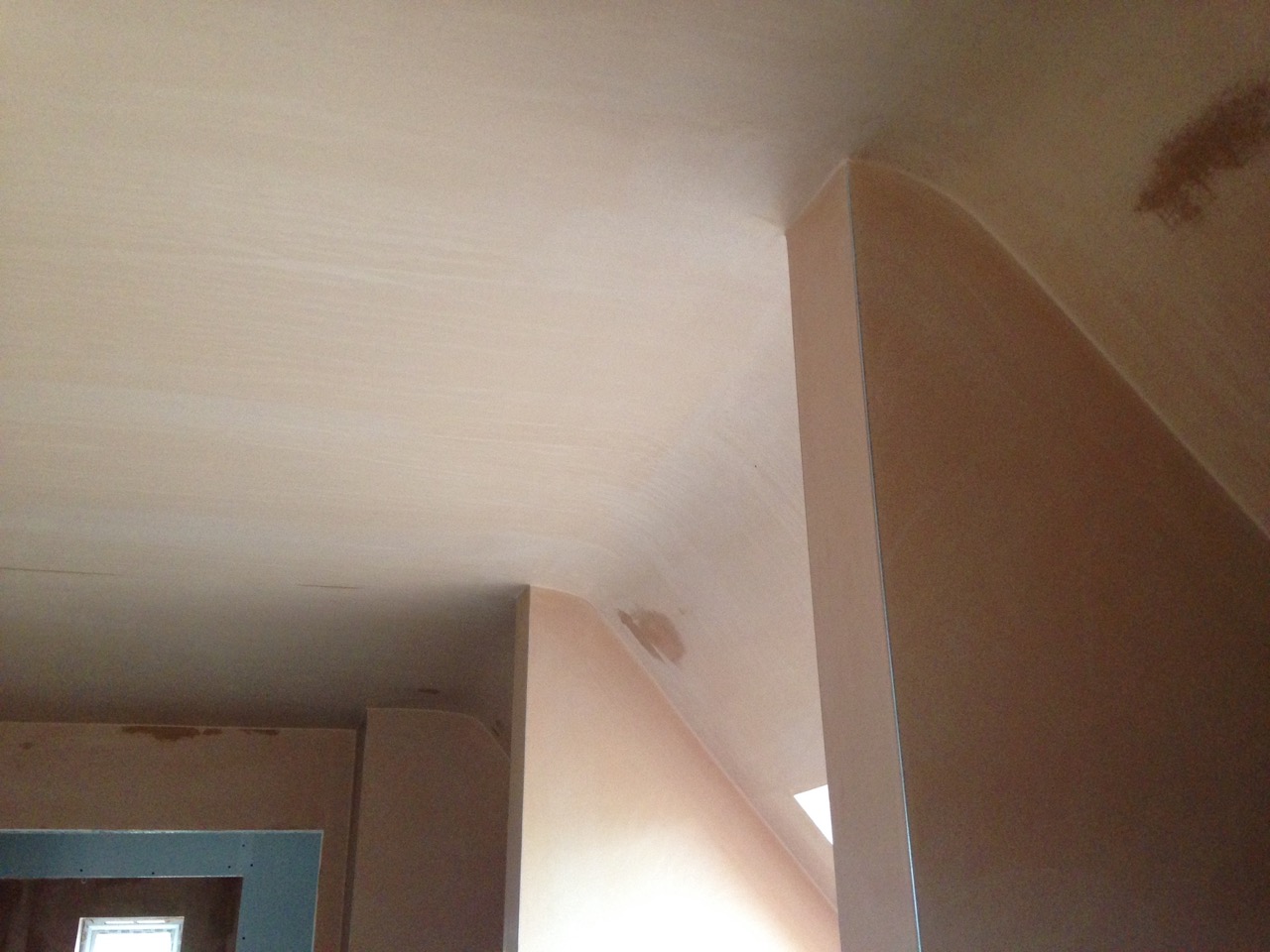 A room under a sloped ceiling, skimmed